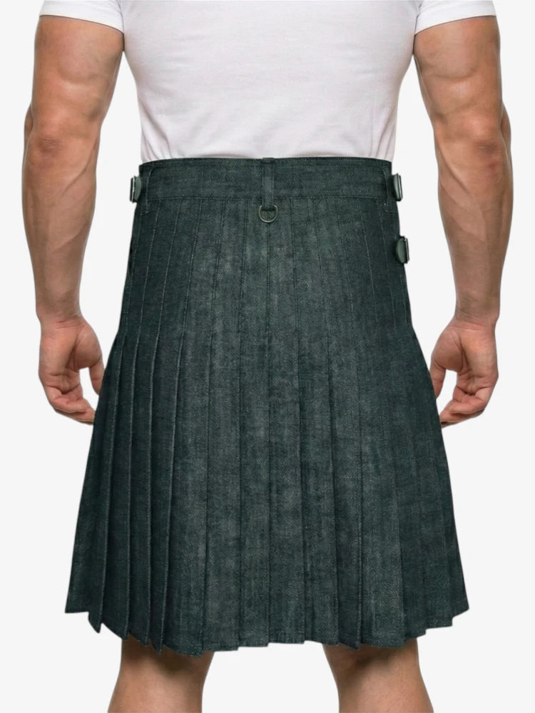 Person wearing a green pleated kilt on a white background