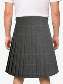 Person wearing a gray pleated skirt on a white background