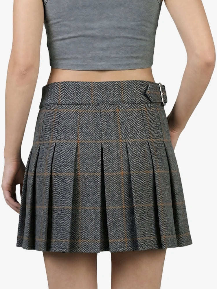 Plaid skirt worn by a person on a white background