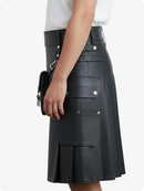 Black leather skirt with multiple pockets on a white background