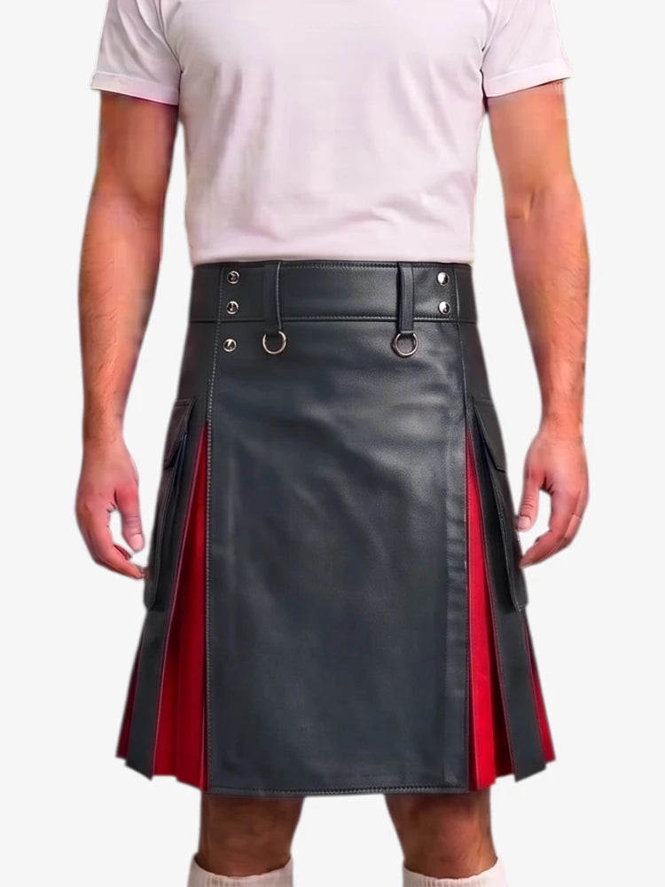 A person wearing a black faux-leather kilt with red side panels and silver metal hardware, paired with a light pink t-shirt against a plain white background.