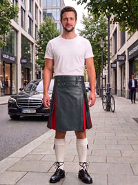 A man stands on a city sidewalk wearing a white crew-neck t-shirt, a dark gray leather kilt with red side panels, white knee-high socks, and black leather shoes. A black Mercedes-Benz car and storefronts are visible in the background.