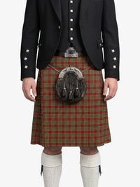 Person wearing a traditional Scottish kilt with a jacket on a white background