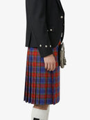 Person wearing a black jacket and red and blue plaid kilt on a white background