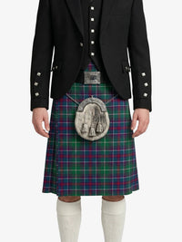 Person wearing a black jacket and green plaid kilt with a silver sporran on a white background