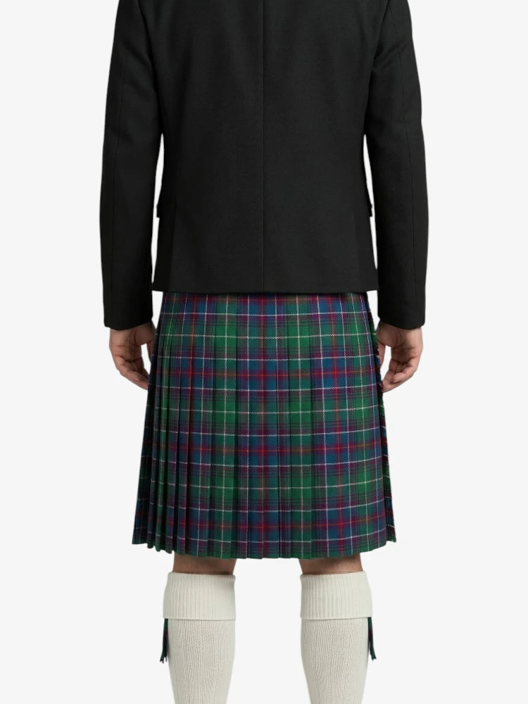 Person wearing a black jacket and plaid kilt on a white background