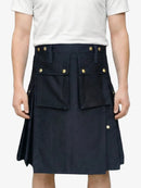 Navy blue kilt with gold buttons worn by a person on a white background