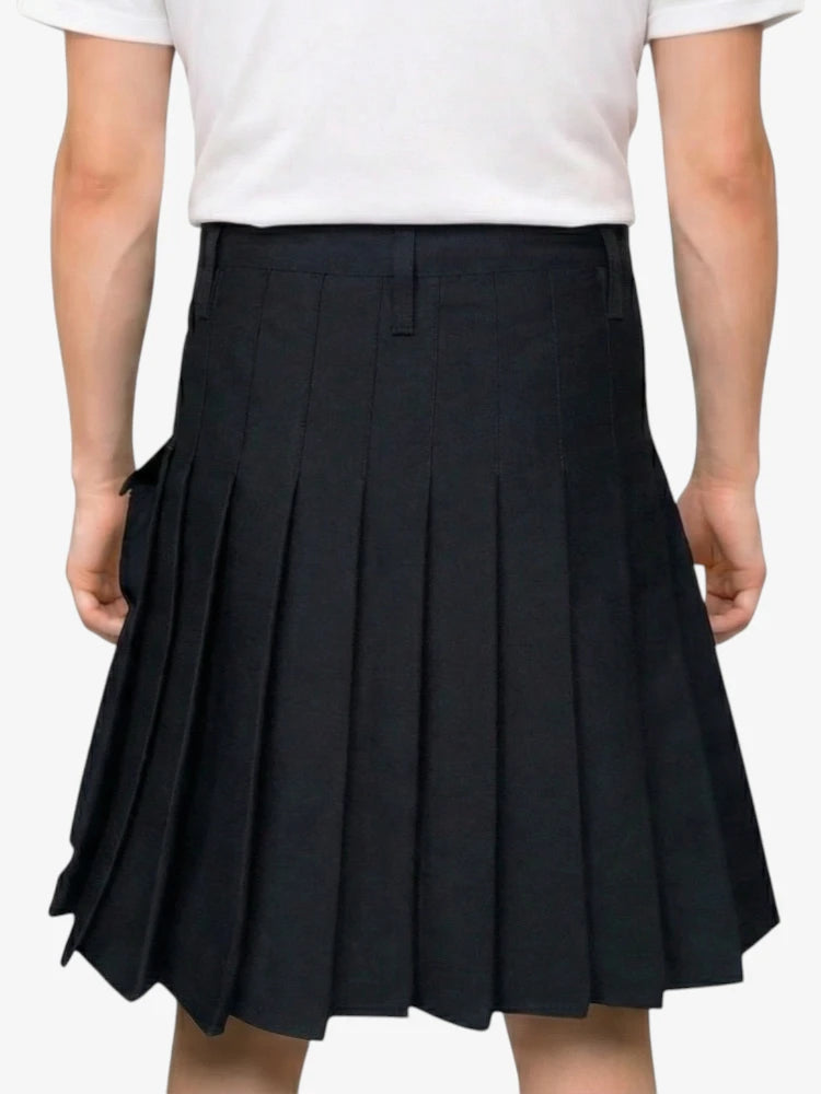 Black pleated skirt worn by a person on a white background