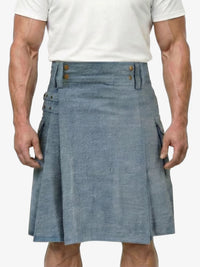 Man wearing a blue kilt on a white background