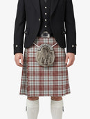 Traditional Scottish kilt with a tartan pattern worn by a person on a white background