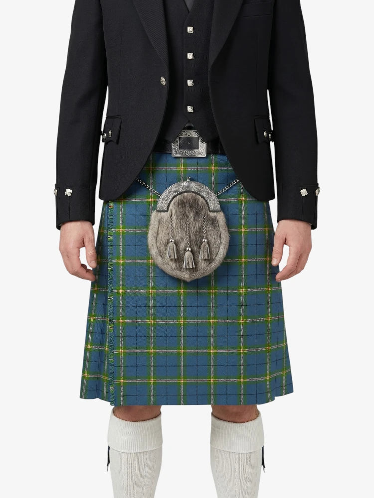 Person wearing a traditional Scottish kilt with a jacket on a white background