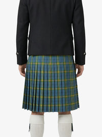 Person wearing a black jacket and blue plaid kilt on a white background