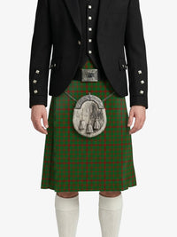 Person wearing a green tartan kilt with a black jacket on a white background