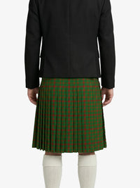Person wearing a black jacket and green plaid kilt on a white background