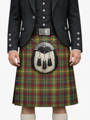Person wearing a traditional Scottish kilt with a tartan pattern on a white background
