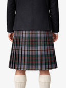 Person wearing a black jacket and plaid kilt on a white background