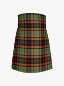 Plaid kilt  with green, red, and black pattern on a white background