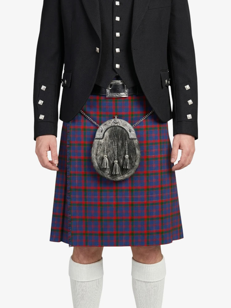 Person wearing a traditional Scottish kilt with a tartan pattern on a white background