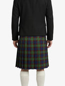 Person wearing a black jacket and plaid kilt on a white background