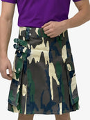 Camouflage kilt worn by a person with a purple shirt on a white background
