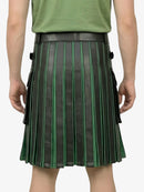 Person wearing a green and black pleated skirt on a white background