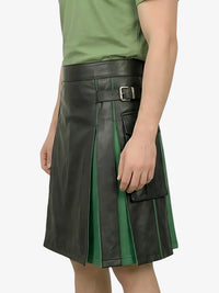 Green and black pleated leather skirt worn by a person on a white background