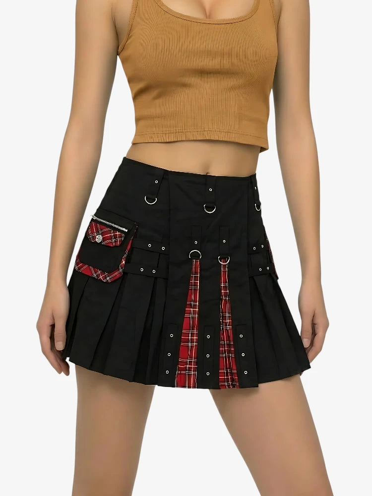 Black skirt with red plaid accents worn by a person on a white background