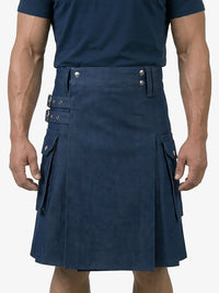 Man wearing a navy blue kilt on a white background