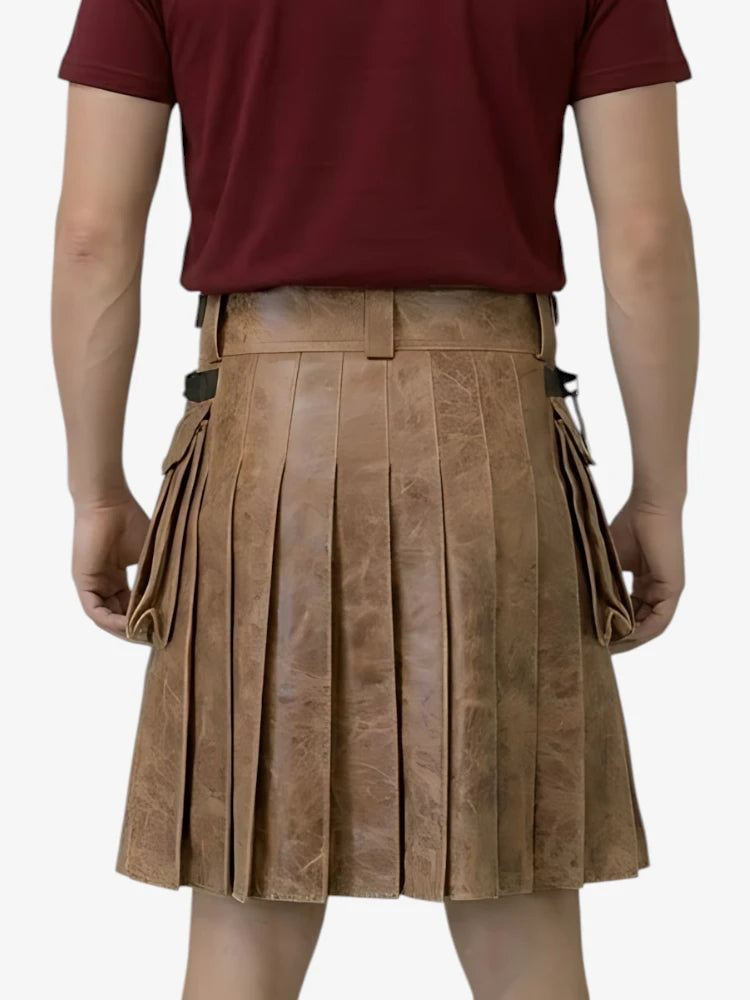 Person wearing a brown pleated skirt with a red shirt on a white background