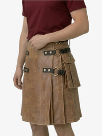 Brown leather kilt with metal buckles worn by a person on a white background