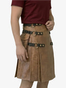 Person wearing a brown leather kilt with decorative belts on a white background