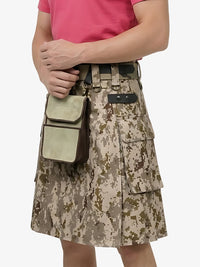 Person wearing a digital camouflage kilt with a belt and pouch on a white background