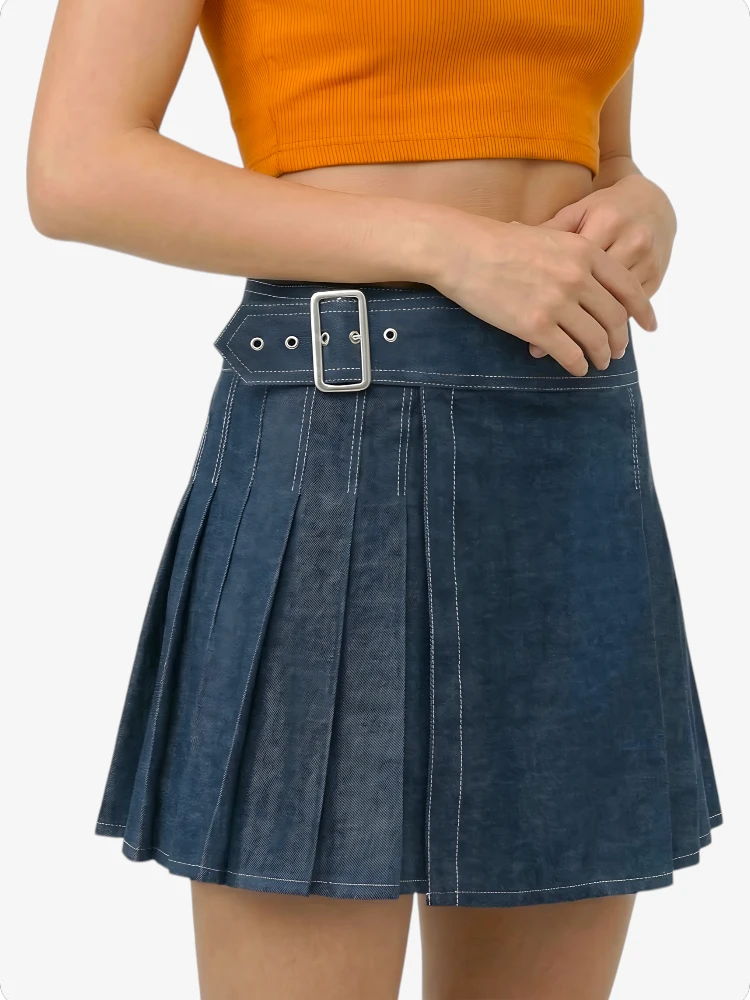 Person wearing a blue pleated skirt with a belt on a white background