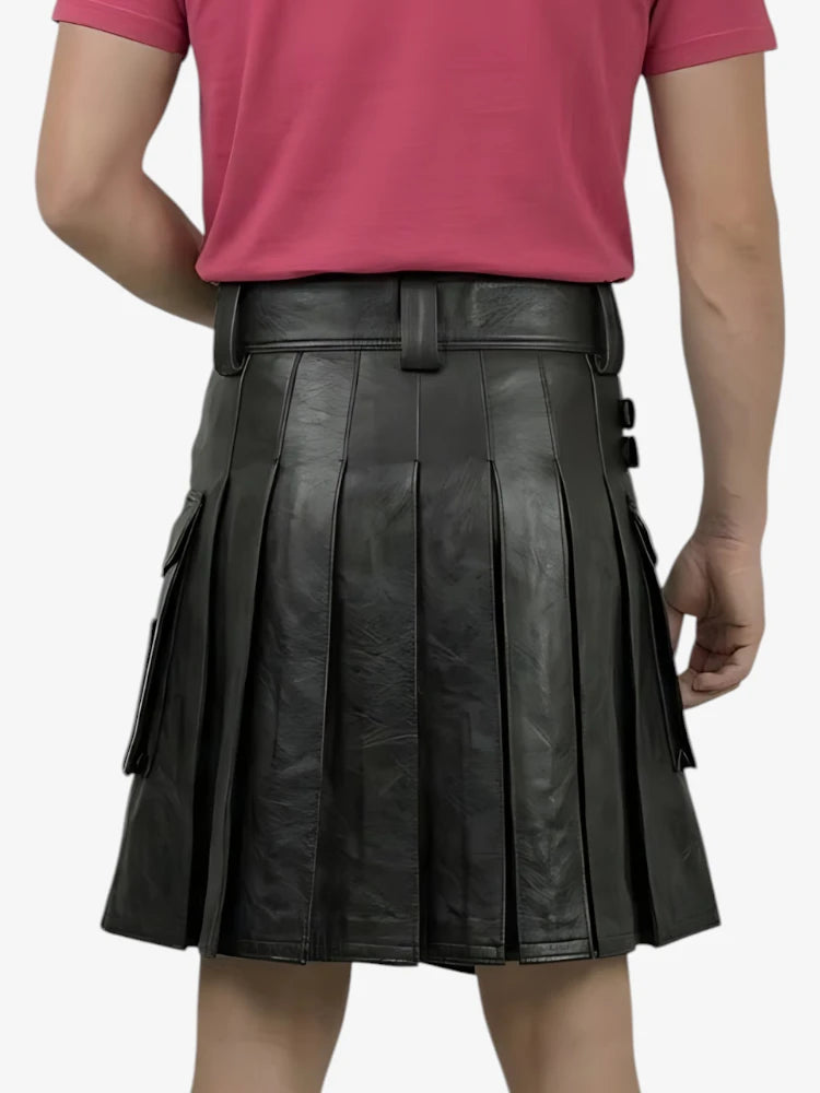 Black pleated leather skirt worn by a person on a white background