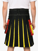 Black kilt with yellow and red accents worn by a person on a white background