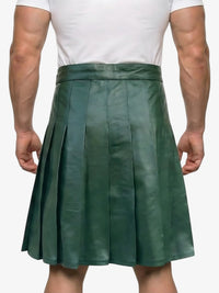 Green pleated skirt worn by a person on a white background