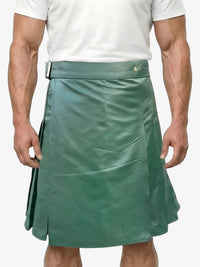 Green kilt worn by a person on a white background