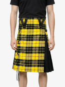 Person wearing a yellow and black plaid kilt on a white background