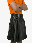 Person wearing a black leather kilt with a belt on a white background