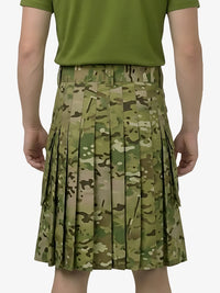Person wearing a green pleated skirt with a camouflage pattern on a white background