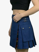 Blue plaid skirt with gold buttons worn by a person on a white background