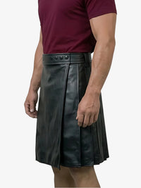Black leather kilt worn by a person on a white background