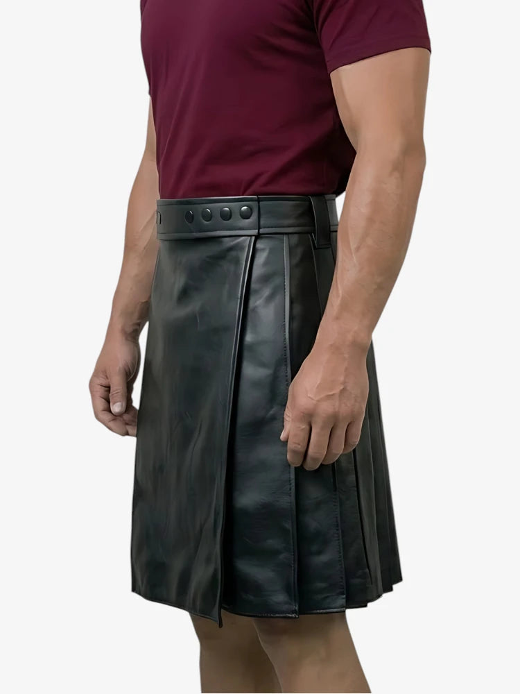 Black leather kilt worn by a person on a white background