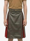 Person wearing a green leather skirt with red accents and a brown top on a white background