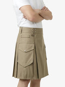 Person wearing a beige kilt on a white background