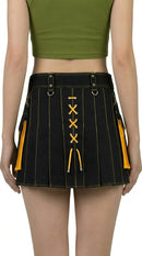 Black and yellow pleated skirt worn by a person on a white background