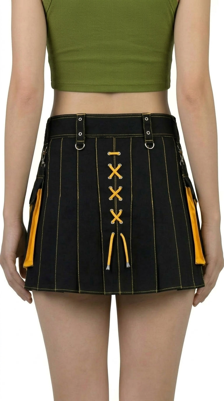 Black and yellow pleated skirt worn by a person on a white background