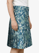 Person wearing a blue camouflage skirt on a white background