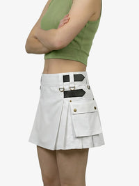 Person wearing a white skirt with black accents on a white background
