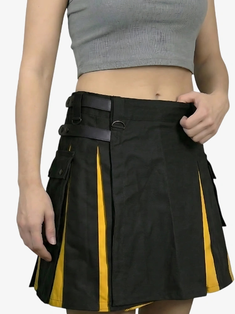Person wearing a black and yellow skirt with a plain background